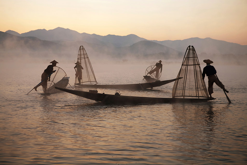 A group of fishermen paddling boats with fishing nets. Even they can be reached with private email for global privacy.